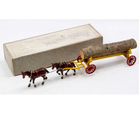 A Charbens series lead hollow cast model tree wagon comprising of yellow wagon with two horses, a set of whipple trees and lo