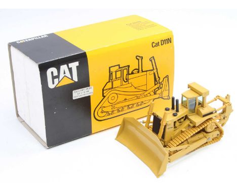 A Conrad No. 2852 1/50 scale model of a Caterpillar D11N track type tractor, housed in the original polystyrene packed box wi