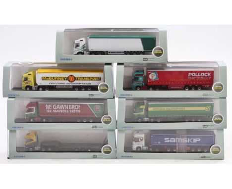 One tray containing a collection of N gauge scale Oxford diecast commercial vehicles to include a Volvo FH4 semi loader with 