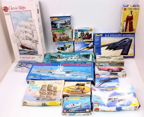 A collection of 18 mixed model kits with examples including an Airfix 1/32nd scale E Type Jaguar, a Heller 1/72nd scale Messe