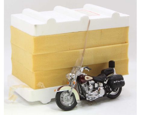 A Franklin Mint 1/10 scale model of a Harley Davidson Heritage soft tail classic motorcycle housed in the original polystyren