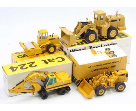 A collection of four various boxed Caterpillar Conrad, NZG and Supermini 1/50 scale construction diecast vehicles to include 