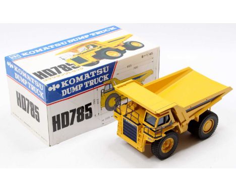A Shinsei 1/45 scale model of a Komatsu HD785 dump truck housed in the original polystyrene packed box, appears as issued