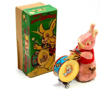 An Alps Toys of Japan tinplate and soft covered model of Peter the Peppy Drummer, comprising of pink soft covered rabbit with