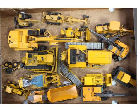 One tray containing a quantity of various manufactured, later adapted and damaged mixed-scale construction diecasts to includ