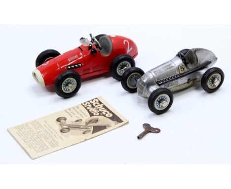 A collection of Schuco tinplate and clockwork Grand Prix style race cars to include a No. 1070 Ferrari comprising red body wi