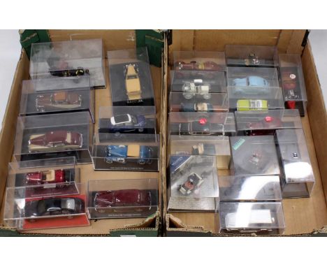 Two trays containing a good selection of various plastic cased Vitesse, Ixo, TSM and similar, 1/43 scale diecasts to include 