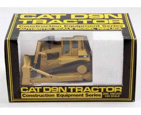 An NZG No. 298 1/50 scale model of a Caterpillar D9N track type tractor, housed in the original polystyrene packed window box