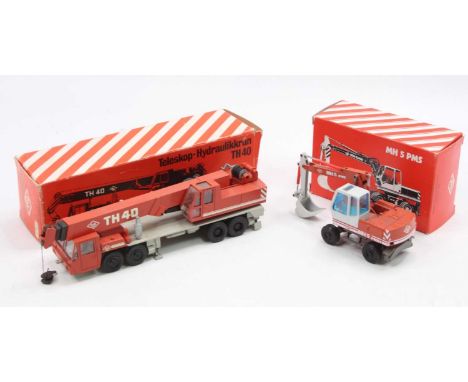 An NZG O&amp;K 1/50 scale earth moving and construction diecast group to include an NZG No. 193 TH40 Telescopic Crane togethe