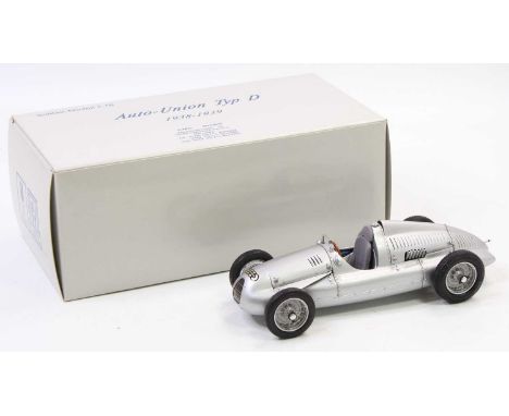 A CMC Exclusive Models No. M-027 1/18 scale of an Auto Union Typ D 1938-1939 racing car comprising a silver body and wirework