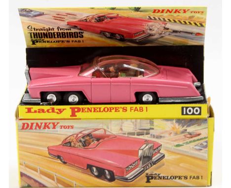 A Dinky Toys No. 100 Lady Penelope's Fab 1 comprising of dark pink body with gold interior, driver, and Lady Penelope and Par