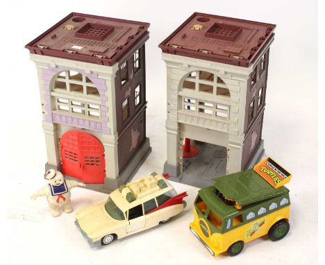 Collection of vintage Teenage Mutant Ninja Turtles and Ghostbuster figures and accessories, together with two plastic towers,