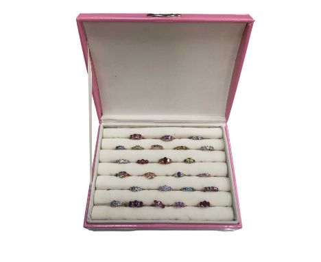 Twenty five 9ct gold multi-gem set rings within a ring display caseTotal weight 52.8 grams