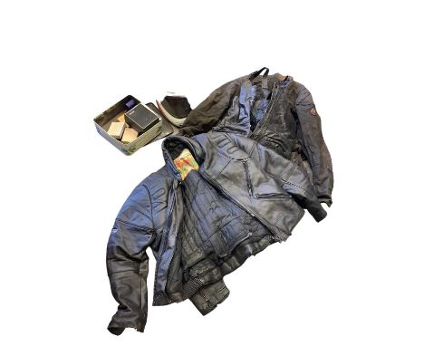 Two boxes of motorcycle related items to include helmet, leathers other clothing and Honda manuals, parts lists and other rel