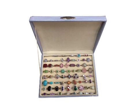 Collection of silver multi-gem set dress rings within a ring display case (66)