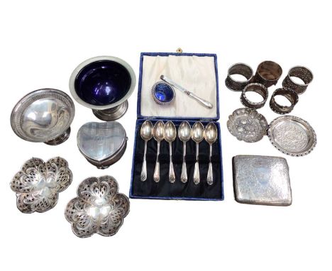 Group of silver including a heart shaped jewellery box, cigarette case, various dishes, set of six golfing spoons in case, na