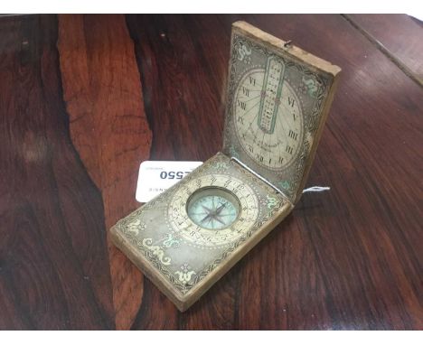 19th century folding wooden pocket sundial and compasss signed Nigelein at Nuremberg in Bavaria with printed paper dials
