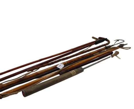 Three old boat hooks, together with a group of walking sticks, fruit thermometer, etc