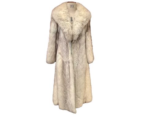 A vintage arctic fox fur coat, Selfridges London. Plus a blonde mink coat, brown mink wrap, and one other brown fur jacket.No