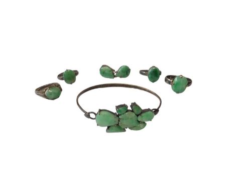 Chinese silver bangle mounted with seven green jade/ hard stone panels, together with four Chinese silver and green jade/ har