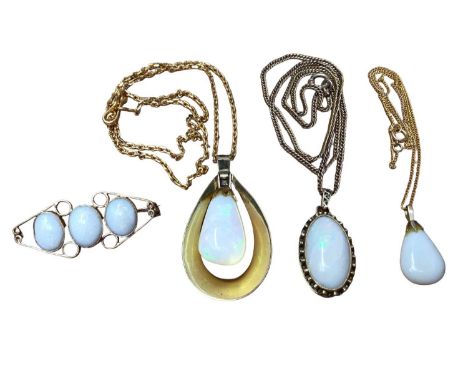 Two 18ct gold mounted opal pendants on yellow metal chains, 18ct gold mounted opal three stone brooch and one other opal pend