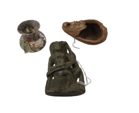 Roman glass flask with label ' from Mount of Olives', Roman pottery oil lamp and carved stone figure candle holder (3)