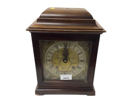 British made 'Empire' bracket clock, the brass and silvered dial with Roman numerals, and engraved and relief decoration, 27c