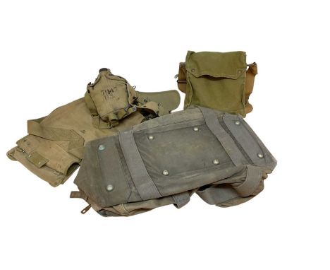 Second World War American Army canvas webbing covered water bottle, belt, pouches and other webbing items including a gas mas