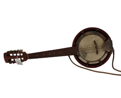 A cased ukulele and a banjolele (2)