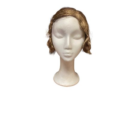 1920s mannequin wig with metallic thread construction.  The lining is present and intact, but does have a couple of small spl