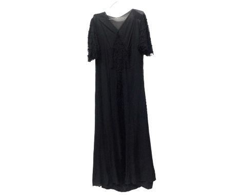 Three 1920's/30's black dresses includes two net and lace evening dresses and overskirt plus a velvet cloak with ruched colla
