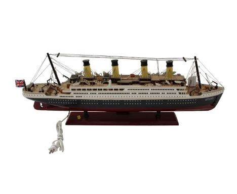 Wooden model of the Titanic on base with inscription, 80cm long