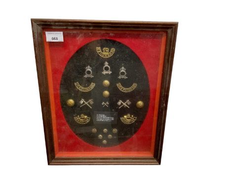 Group of Sikh Pioneers and Mahratta Light Infantry buttons and badges in glazed frame.