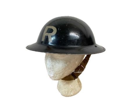 Second World War British Military MKII Steel Helmet with black painted finish and 'R' to front, with chinstrap and liner, dat
