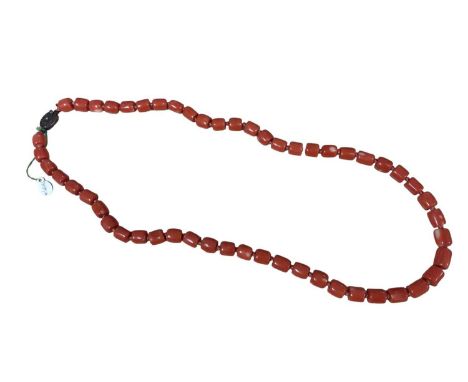 Old Chinese coral necklace with barrel shaped polished beads and oval silver gilt clasp with wire work flower decoration, 63c