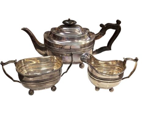 Victorian silver three piece tea set comprising of a teapot with ebony handle and finial, milk jug and two handled sugar bowl