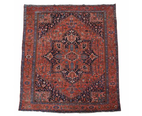 A Serapi carpet , decorated throughout with abstract foliate motifs  A Serapi carpet  , decorated throughout with abstract fo