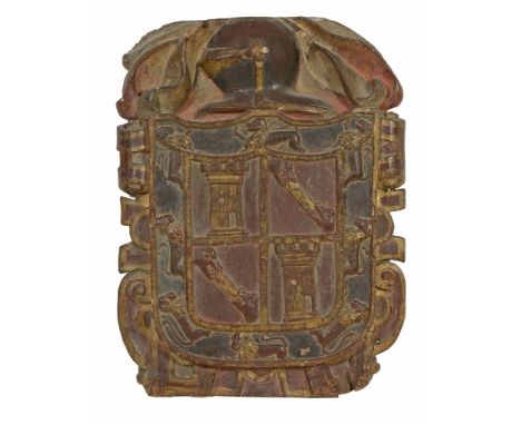 A Spanish carved, painted and parcel gilt walnut armorial panel  A Spanish carved, painted and parcel gilt walnut armorial pa