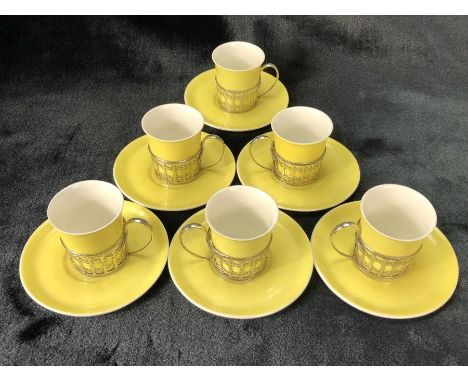 Set of six Shelley espresso cups and saucers in yellow with hallmarked silver holders