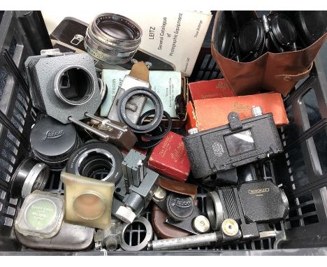 Collection of photographic / camera items to include lenses, manuals, many by Leitz