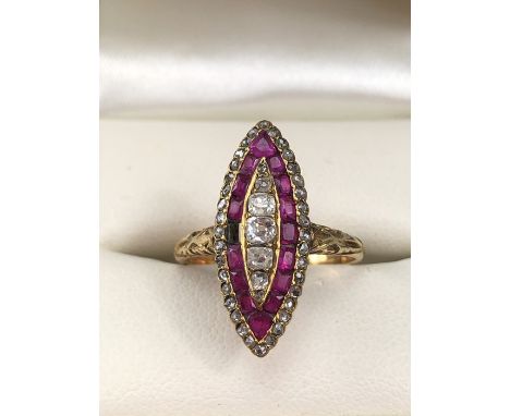 18ct Gold marquis ring set with an outer layer of rose cut diamonds, five old mine cut Diamonds to the centre and a middle ri