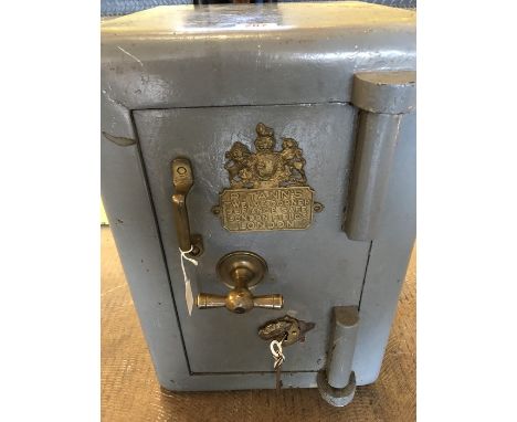 Vintage safe by "R. TANN'S TWELVE CORNER DEFIANCE SAFE. LONDON FIELDS LONDON." Grey with brass fittings opens to reveal inner