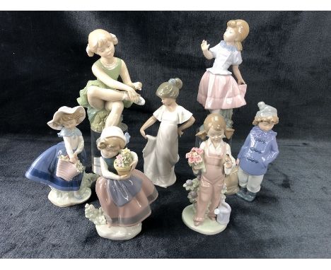 Collection of three Lladro and three Nao figurines, along with a figurine of a ballerina by D'avila Spain 