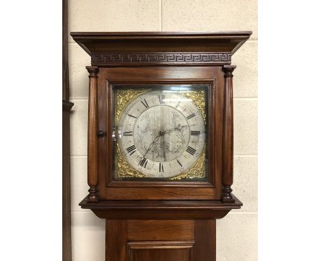 Attractive four day longcase clock with silver dial and black roman numerals, mahogany case, weights and pendulum