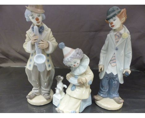 Collection of three Lladro clowns, one playing the saxophone, One holding a violin and another playing an accordion with a pu