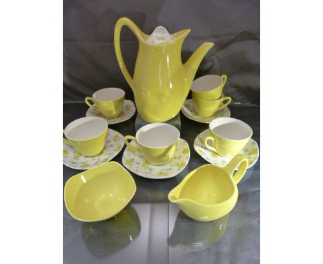 Part Midwinter Savanna pattern coffee service designed by Jessie Tait. Compromising five saucers, six cups, sugar bowl, milk 