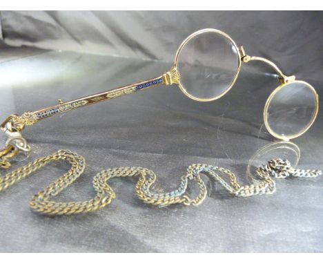 Gold coloured pair of spring loaded Pince-Nez with blue enamel decoration and hung on base metal chain 