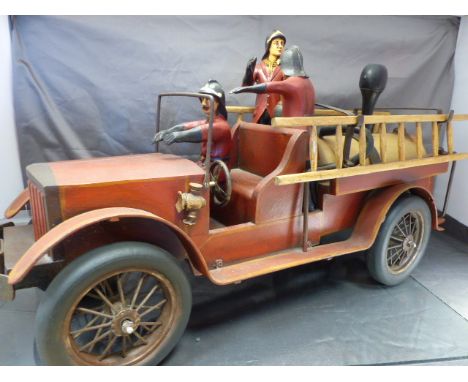 Large antique wooden and metal fire engine, rubber wheels. Two vintage wooden ladders. Three fireman made from resin.