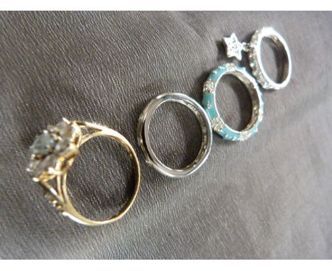 Mixed lot of four rings - 9ct CZ ring, Oval aquamarine type stone with 8 CZ stones around it. Size M. Also three silver (925)