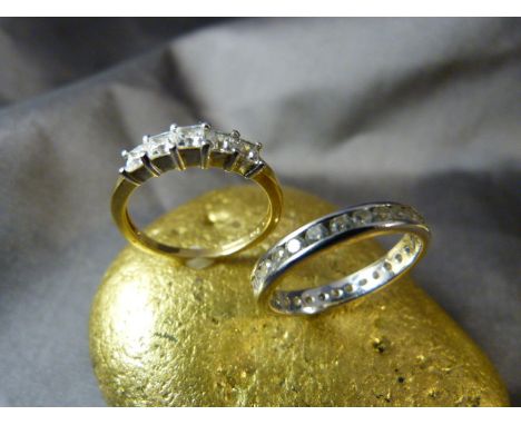 Two 18ct Gold CZ set rings. (1) White Gold full ET ring set with 29 brilliant cut CZ stones. (2) 18ct Yellow and White Gold r